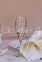A place setting with a glass of champagne