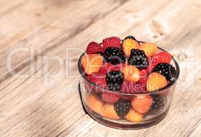 Organic golden and red raspberries mixed with blackberries