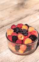 Organic golden and red raspberries mixed with blackberries