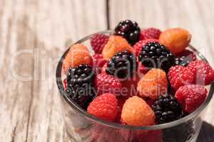 Organic golden and red raspberries mixed with blackberries