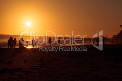 Silhouette of people enjoying the beach