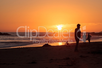 Silhouette of people enjoying the beach