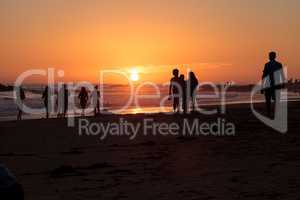 Silhouette of people enjoying the beach