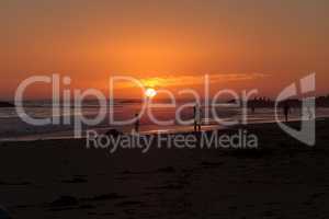 Silhouette of people enjoying the beach