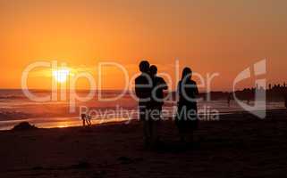 Silhouette of people enjoying the beach