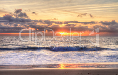 Sunset over the ocean at One Thousand Steps Beach