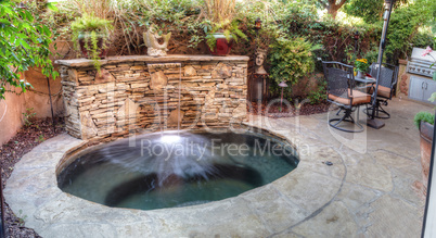 Oval hot tub spa with waterfall