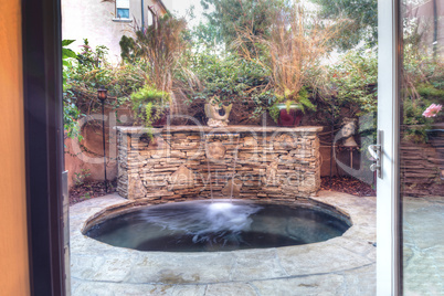 Oval hot tub spa with waterfall