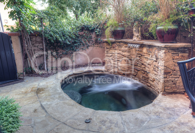 Oval hot tub spa with waterfall