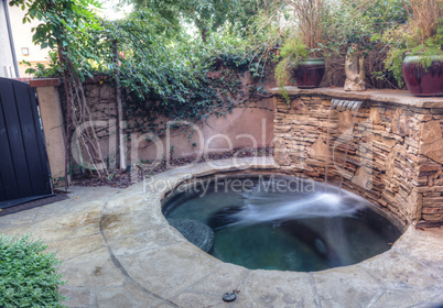 Oval hot tub spa with waterfall