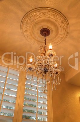 chandelier with crown molding.