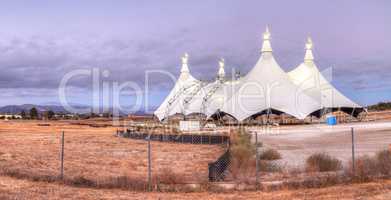 Sunset over a large circus tent