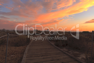 Boardwalk at Crystal Cove beach in California at sunset