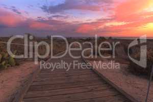 Boardwalk at Crystal Cove beach in California at sunset