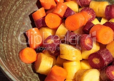 Chopped colorful red, yellow and orange organic carrots