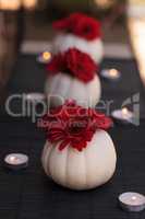 Red gerbera daisies in carved white Casper pumpkins