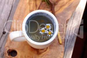 Chamomile tea with chamomile daisy flowers