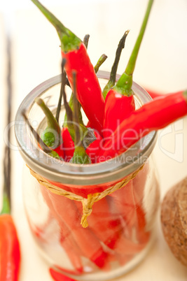 red chili peppers on a glass jar