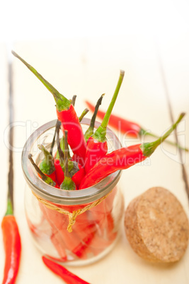 red chili peppers on a glass jar