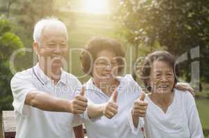 Group of Asian seniors showing thumbs up