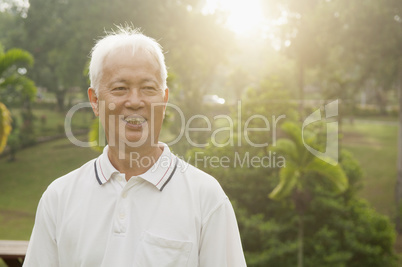 Asian seniors man smiling at outdoor park