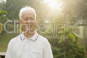 Asian seniors man smiling at outdoor park