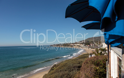 View of Main Beach in Laguna Beach from a restaurant under an um