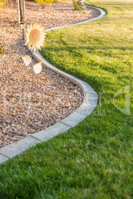 Beautiful Concrete Coping Along Lush Green Grass in Yard.