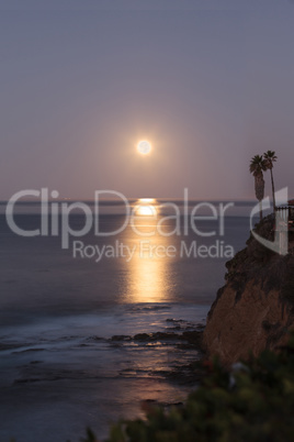 Super moon sets over the Pacific ocean
