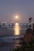 Super moon sets over the Pacific ocean