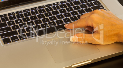 Female finger on the space bar key