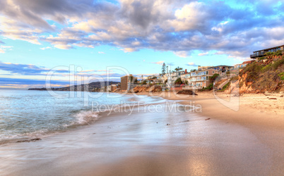 Sunset over the rocks at Pearl Street Beach