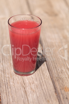 Pink glass of red watermelon fruit juice