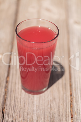 Pink glass of red watermelon fruit juice