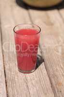 Pink glass of red watermelon fruit juice
