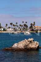 Sailboat and a motorboat leaving the harbor