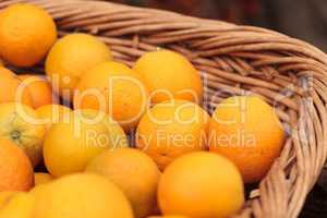 Fresh oranges in a fruit basket