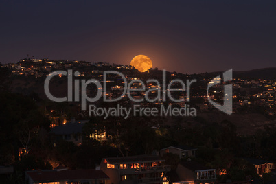 Moonrise of a full moon over the coastline of Laguna Beach