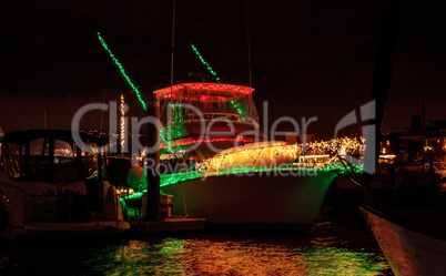 Colorful holiday lights on sailboats