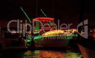 Colorful holiday lights on sailboats