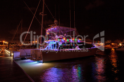 Colorful holiday lights on sailboats