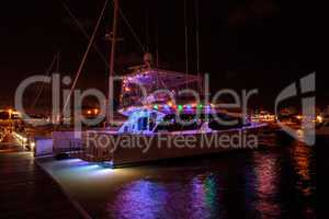 Colorful holiday lights on sailboats