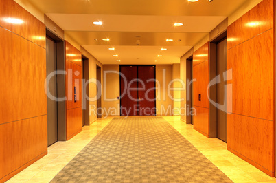 Polished, high end up and down elevator hallway