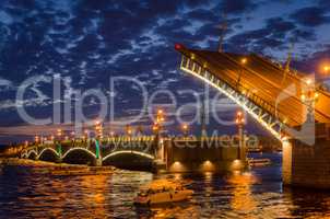 Night cityscape with river and bridge and ship in Saint-Petersbu