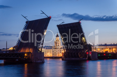 Night cityscape with river and bridge and ship in Saint-Petersbu