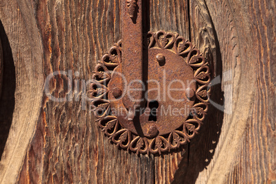 Ornate rusty door keyhole