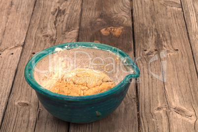 Bread dough rises in a bowl