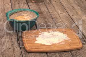 Bread dough rises in a bowl