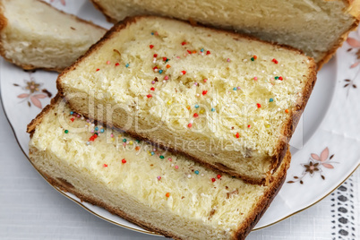 Appetizing sweet white bread on the plate.