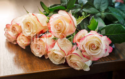 Bouquet of roses on the table.